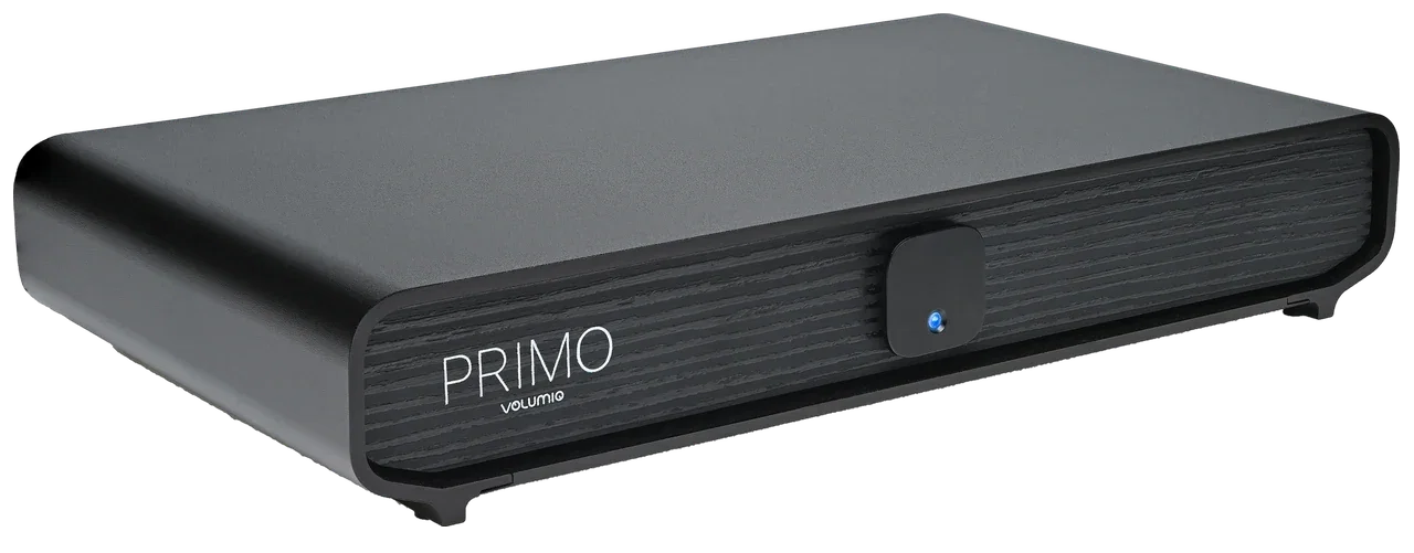 Volumio Primo V3 seen from the front left: a black case with a wood-textured front, the Primo name and a square button with a blue light.