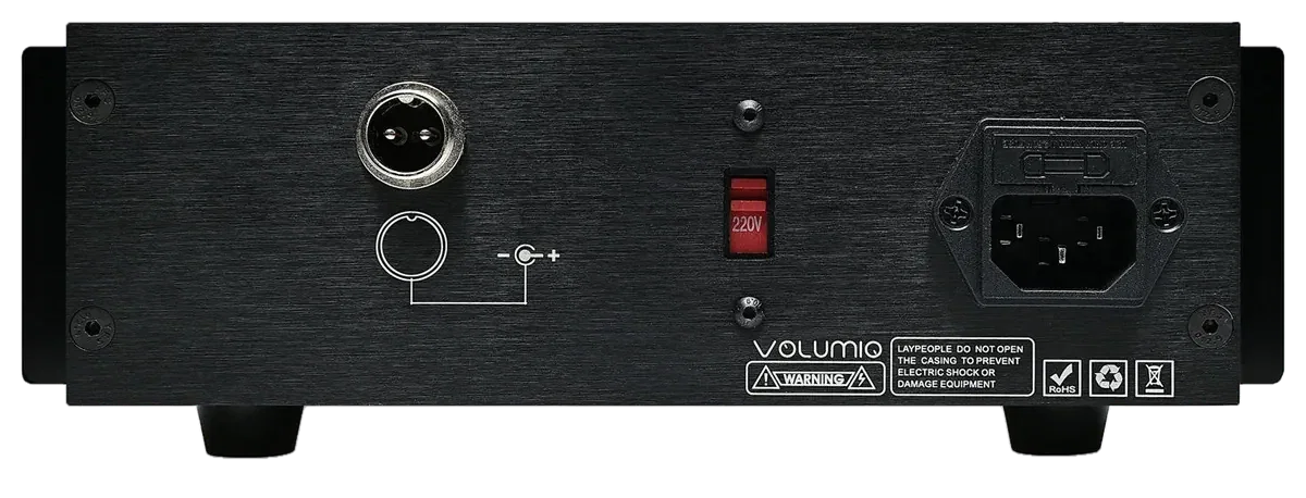 The back of Lineo5, from left: a round output socket with two pins and a polarity symbol, a red voltage switch set to 220V, and the mains power inlet.